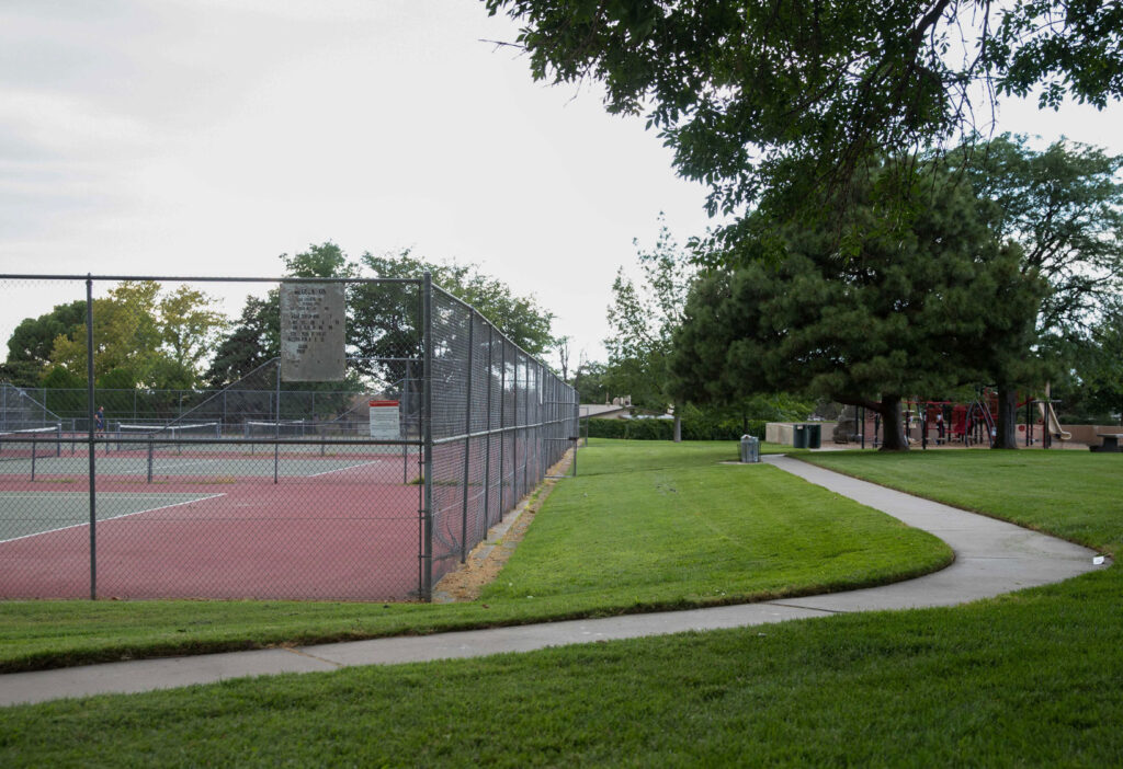 image of sister cities park with tennis courts and play structure